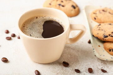 Cup of hot coffee on light background
