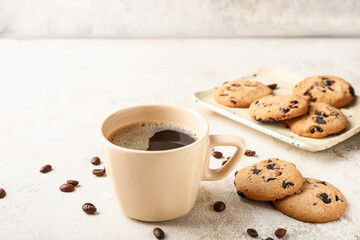 Cup of hot coffee on light background