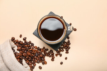 Cup of hot coffee on color background