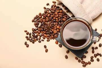 Cup of hot coffee on color background
