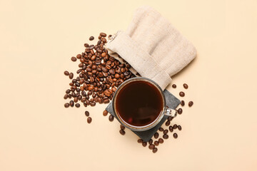 Cup of hot coffee on color background