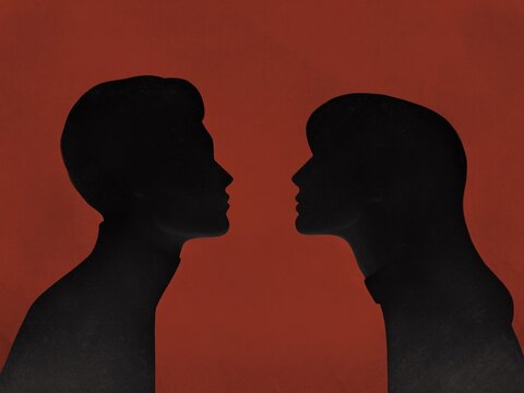 silhouettes of two lovers on a red background