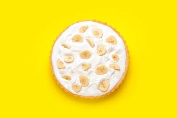 Tasty banana pie on color background
