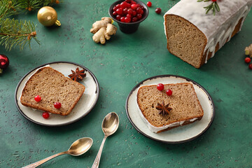 Plates with pieces of gingerbread cake on color background