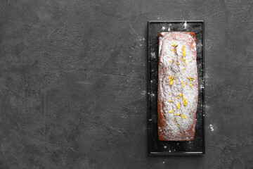 Tray with tasty gingerbread cake on dark background