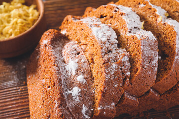 Tasty gingerbread cake on wooden board, closeup