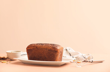 Plate with tasty gingerbread cake on table