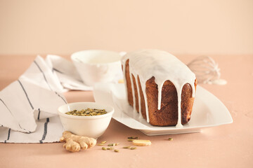 Plate with tasty gingerbread cake on light background