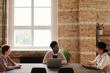 Sharing promotion ideas at staff meeting