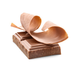 Delicious chocolate pieces and curl on white background