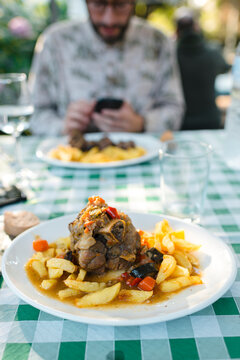 Close up of pork knuckle served on plate