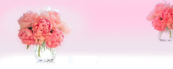 pink rose petals-glass type flower vase pink background