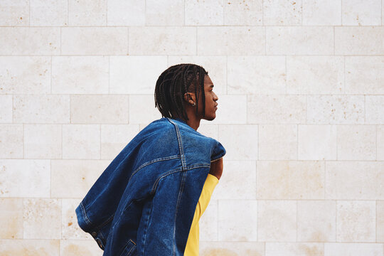 Stylish Young Man Walking Outside