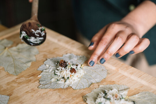 Anonymous Woman Rolling Wine Leaves For Handmade Dolmadakia