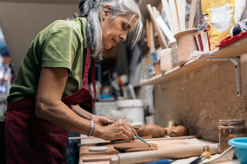 Woman Working in Pottery Workshop