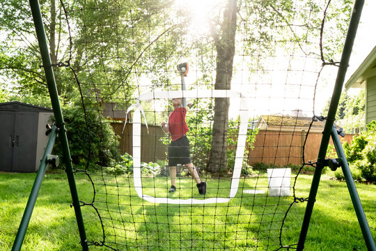 Boy catches basketball on rebound