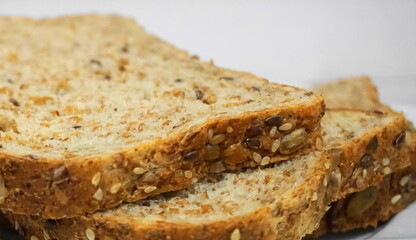Sprouted Whole Grains Sliced Bread close up. Healthy eating concept.