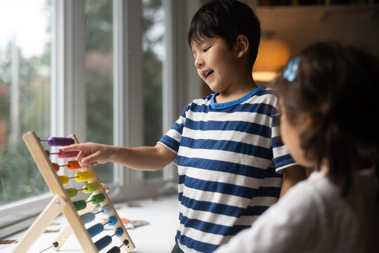 Kids doing math on abacus