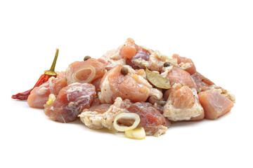 Raw pieces of pork shish kebab in marinade with pepper, onion,bay leaf, ready to cook, barbecue meat, isolated on a white background.