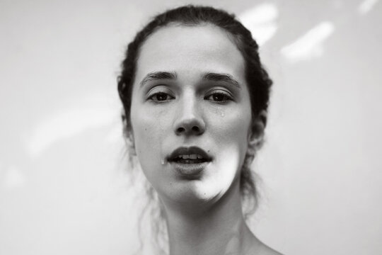 Black and white portrait of crying woman