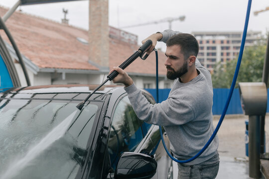 Man Washing His Car