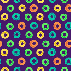 Abstract bright seamless pattern with circles - donuts. Beautiful modern print for textile, fabric, page fill, wallpaper, packaging, design. Hand drawn vector illustration with colorful rings.