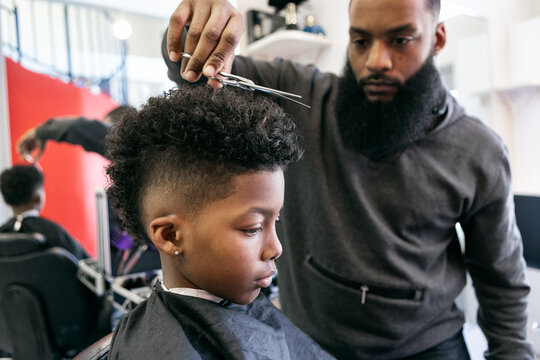 Barber: Stylist Uses Shears To Trim