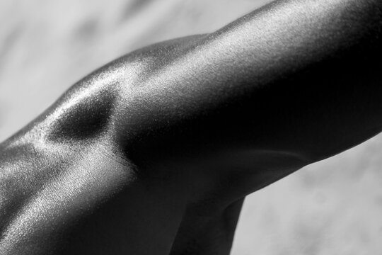 male biceps body detail abstract composition