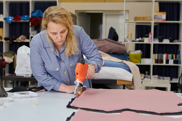 business woman fashion designer at her in her clothing manufacturing office