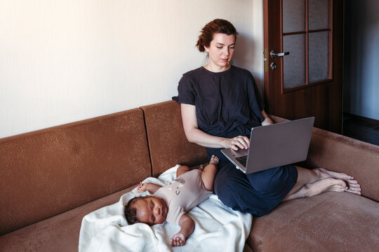 Young mother with her newborn baby.