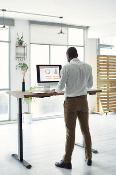Businessman at adjustable table.
