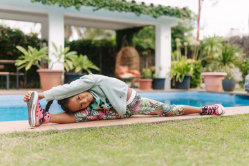 Kid stretching into a side split