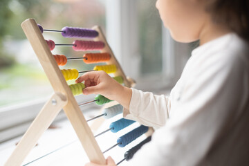 Child counting beads
