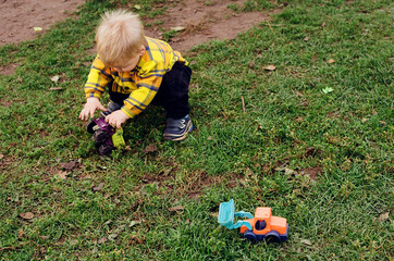 Toddler playing with toys outdoors