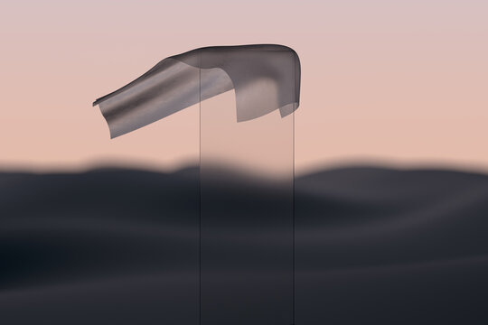 Glass sheet stopping a cloth in the desert