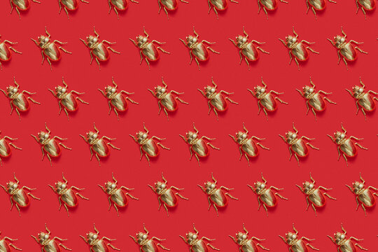 Vertical pattern from metal golden scarab beetles.