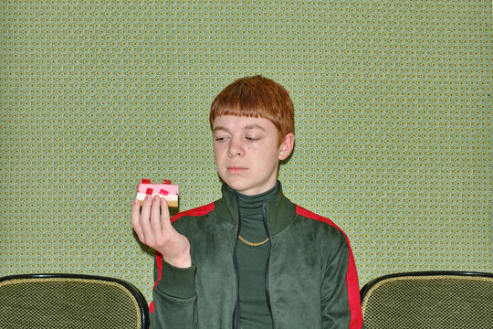 portrait of a teenager with a cake