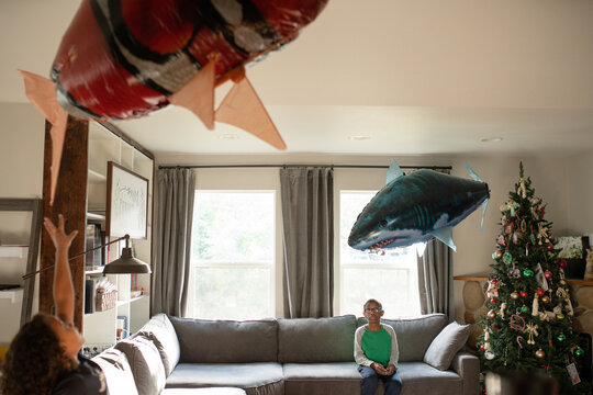 Flying balloon fish in living room at Christmas