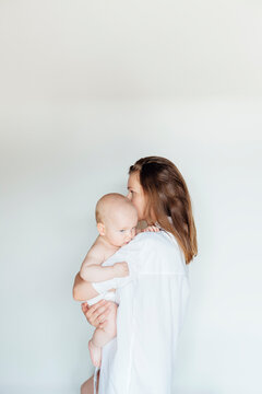 Mother and a baby in white