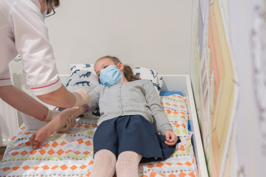 Doctor Preparing To Apply Drip To Patient