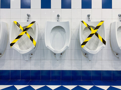 Public Toilet With Protective Tape.