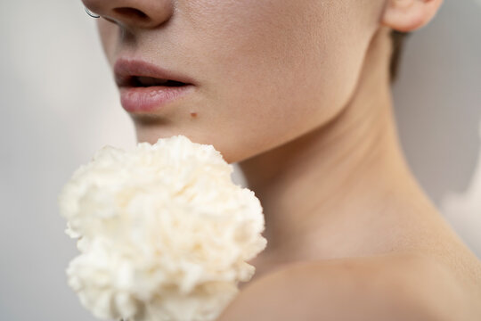 Sensual female with wiite flower