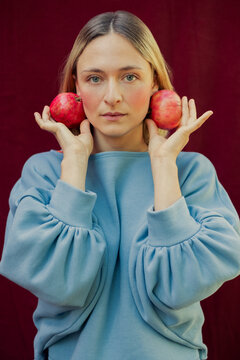 Colorful Portrait of a Blonde Woman Holding Some Organic Fruits