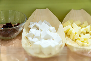 Raw vegan cheese in assortment. Degustation set of vegan cheese made of soy beans, nuts for healthy living.