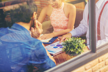Businessman using hand gesture while explain business plan and discussion in the meeting. Selected...