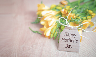 bouquet of yellow flowers on wooden background. mother's day. copy-space. selective focus