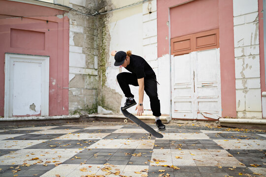 Skater doing trick in the city landscape