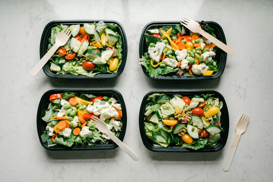 Salad containers prepped for healthy meal planning