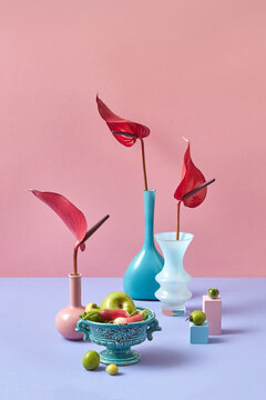Floral set from ceramic colorful vases with flowers.