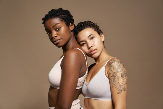 Young women in underwear looking at camera